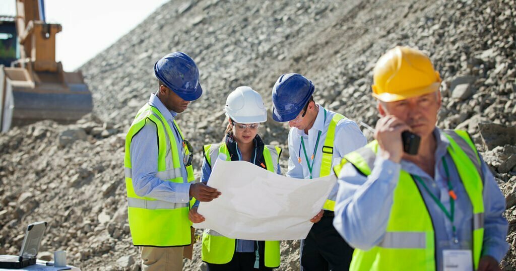 business people talking in quarry