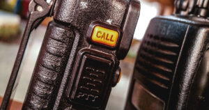 side of walkie talkie with call and ptt button