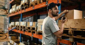 warehouse staff holding walkie talkie