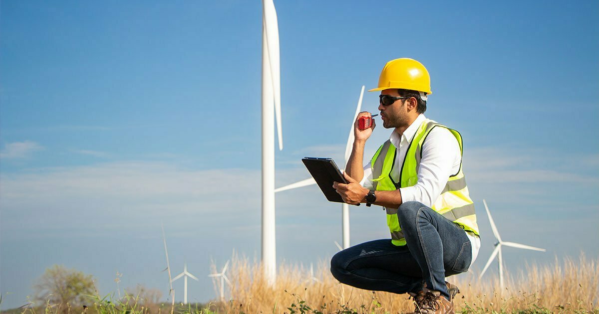 engineer team working in wind turbine farm