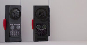 a pair of old walkie talkies of the 80's with morse code information